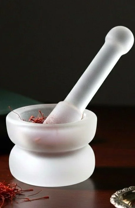 Frosted glass mortar and pestle with saffron threads