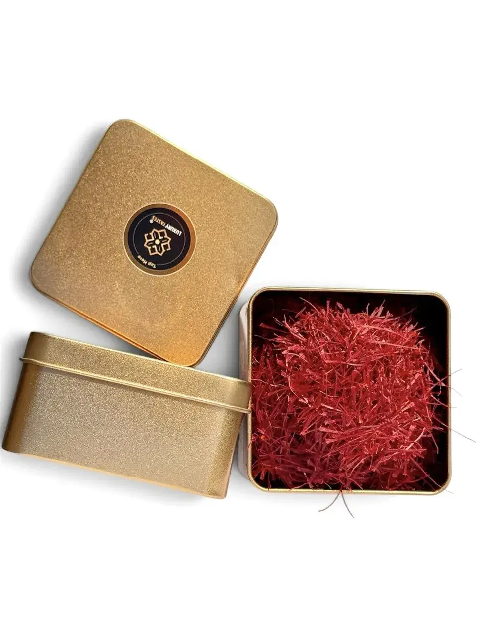 Gold saffron tin open beside its lid